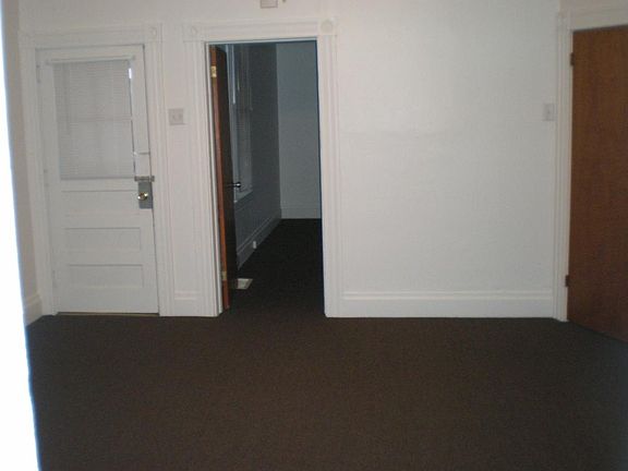 Livingroom wth Frontporch exit & bedroom door