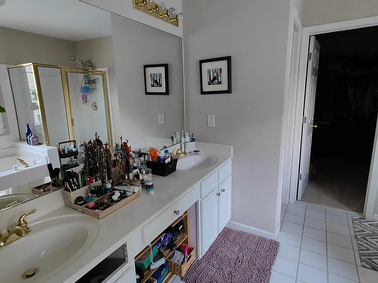Main Bathroom with shower, tub, and toilet. Double sinks.