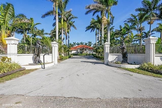 Beautiful Custom built in 2008 Pool Home adjacent to Canal,Immaculately maintained inside and out, 10 +/- Acre working Grove, Lo