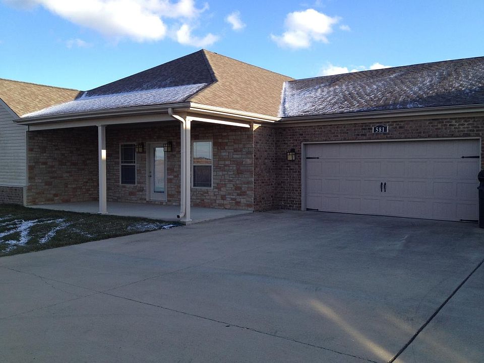 Brick and stone exterior. 2 car garage with 2 parking spots.