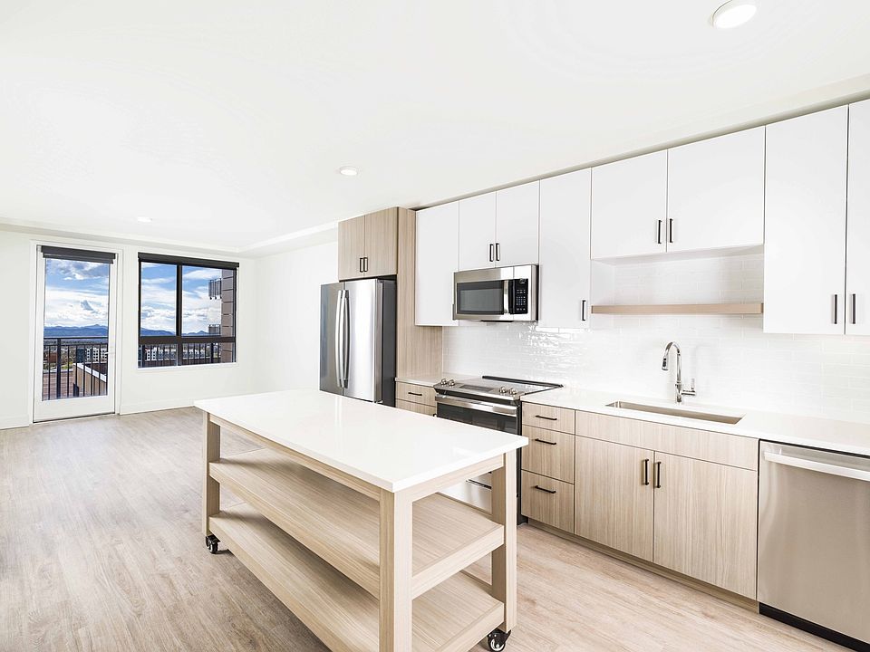 Creating culinary magic with a chef's dream island complete with ample storage, found in the heart of Modera Golden Triangle, Denver, Colorado.