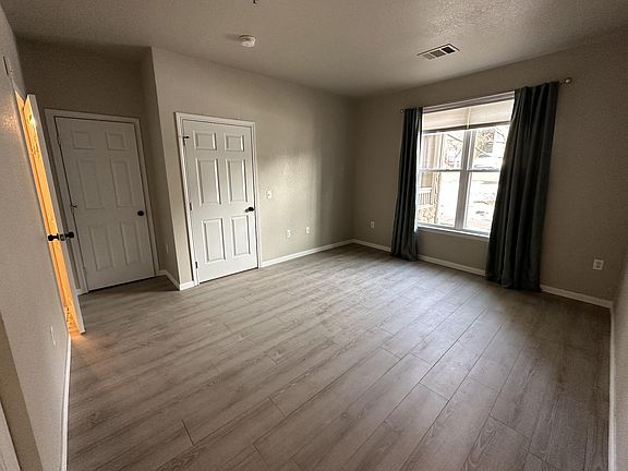Primary bedroom with tub/shower, double sinks, linen closet and large walk in closet.
