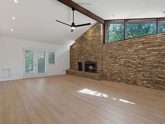 Unit B features a majestic rock feature wall with fireplace