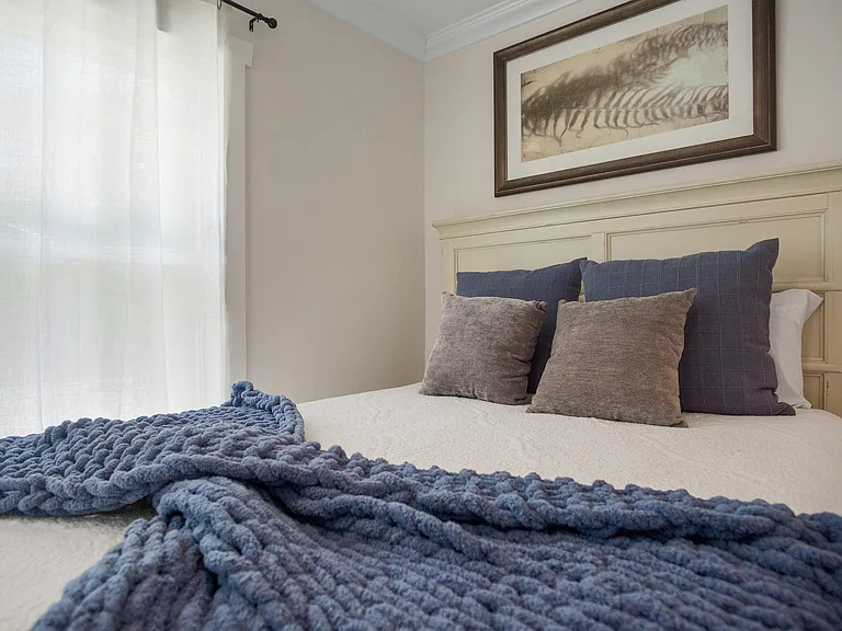 Bedroom 2 with Queen bed, big TV and dressers and large closet.