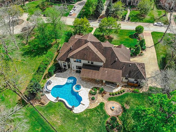 So much Privacy on this lot!!! Check out the CULDESAC on the left side of this photo, and the Green space on the left as well and more Green space behind the home!!! This striking, custom built home, offers all you want and everything you will ever n