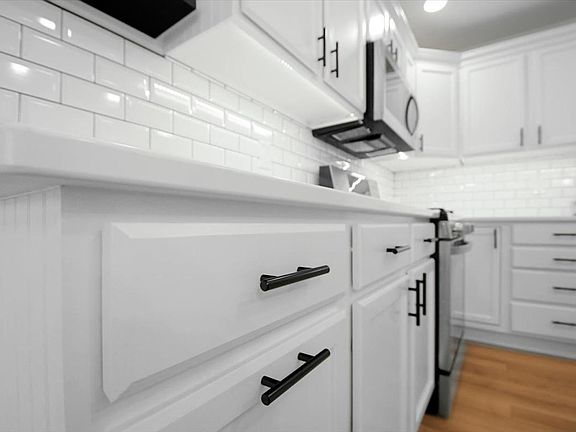 Hidden Trash & Recycle, All New Lighting, New Stainless LG High-End Appliances, New Subway Tile Backsplash, New Vinyl Plank Floors, New White Quartz Countertops.