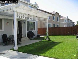 Backyard has it all - shade, sun, lawn, pool!