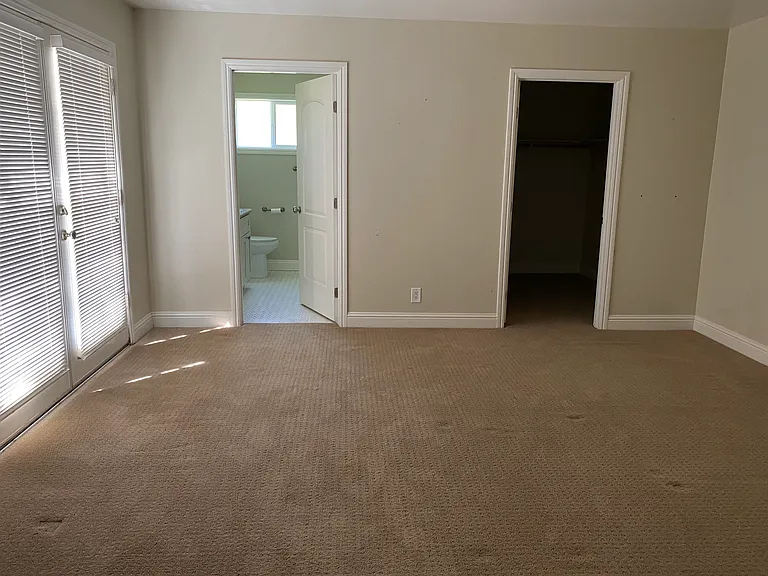 Primary Bedroom with walk-in closet & private bathroom