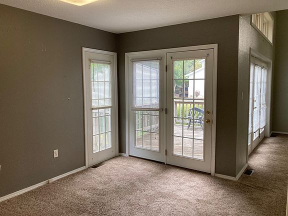 Sitting area between living room and kitchen with access to deck