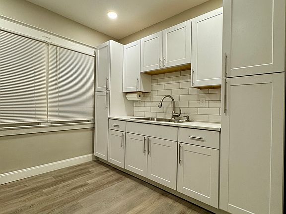 Brand new cabinets with slow close hinges, stainless steel sink and pulldown sprayer faucet accompany new countertops