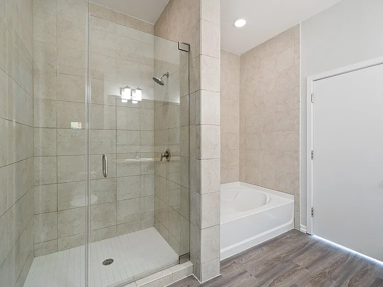 Soaking tubs and stand-in showers available in select homes.