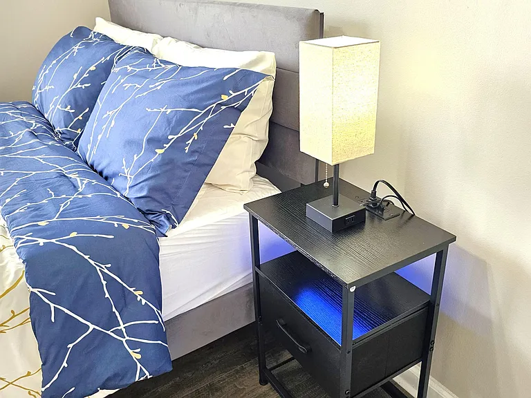 Night stand comes with built-in outlets and ambient lighting