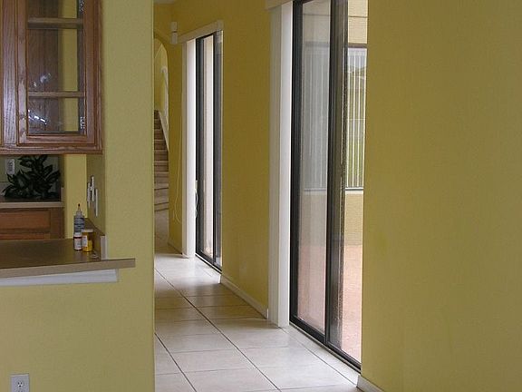 Two sliding doors lead to the side courtyard