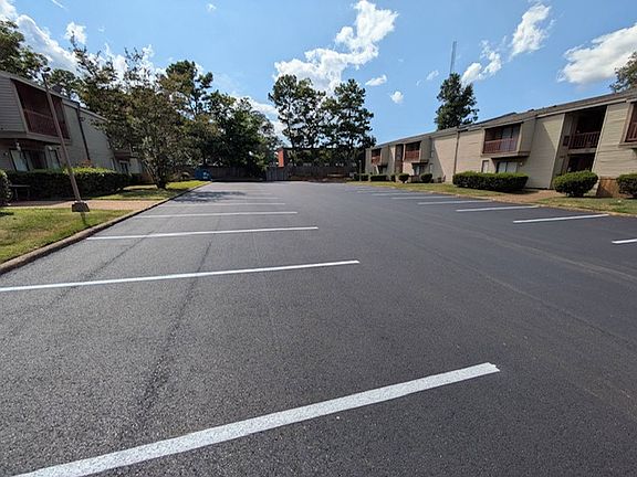 Newly paved parking lot. This lot is Monitored by PBJ towing. One vehicle allowed per unit. Guest pass available.
