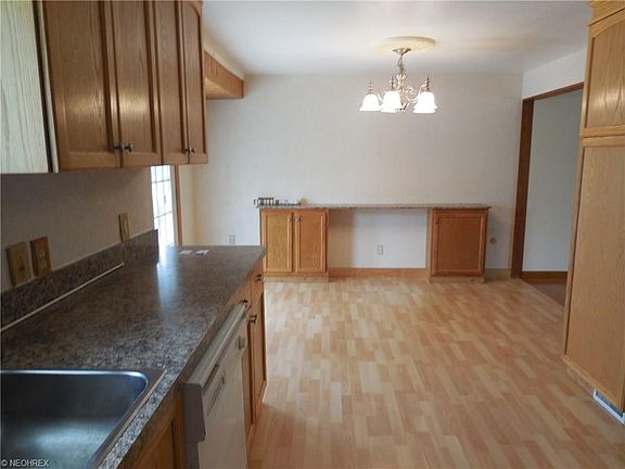 Another view of Kitchen with sliders that lead to Patio