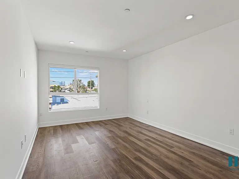 Bedroom with Large-Size Windows, Vinyl Flooring, and Recessed Lighting