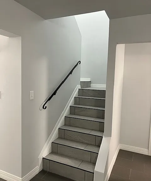 Stairwell, Brand New Tile and Grout, New Baseboard and Molding, Handrails, Chandelier Light. Freshly Painted Ceiling, Walls, Baseboards and Moldings.