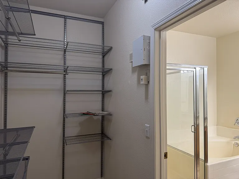 Walk-in closet next to master bath.