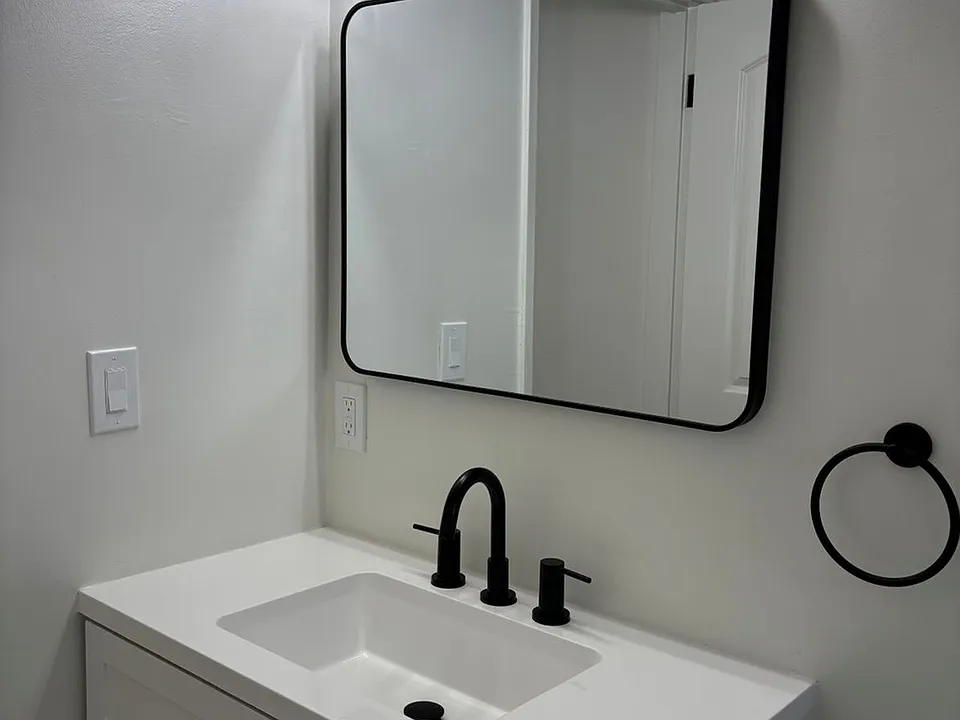 Modern tiled bathroom featuring sleek finishes, updated fixtures, and a fresh, contemporary look designed for comfort and style.