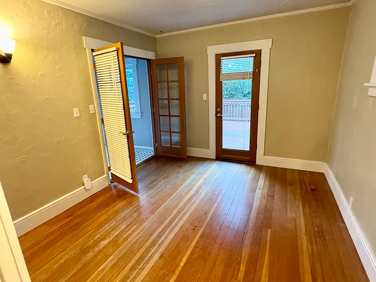 2nd room. French doors and glass door to outside deck. Internet jacks. Can be used as office, dining room, TV room, etc