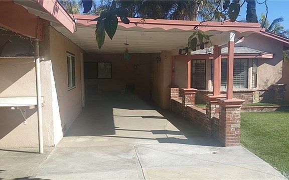 Spacious attached covered lanai with direct access to house and rear of garage.