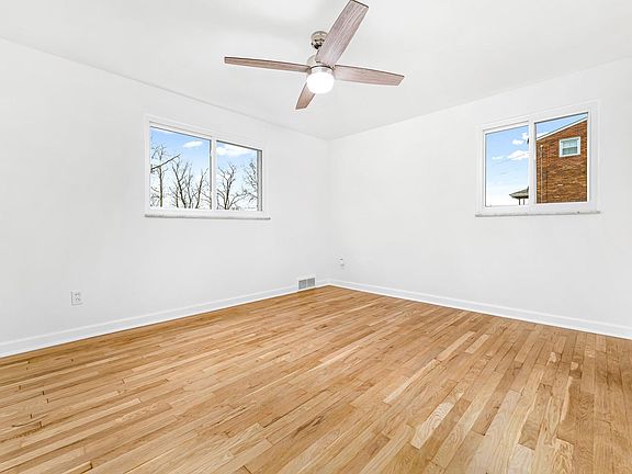 Bedroom 2 with original hardwood flooring