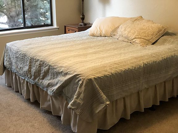 Master King Bed with shade and view of Aspen trees and Blue Spruce