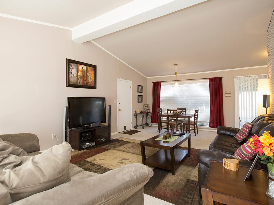 Living room with beamed ceiling