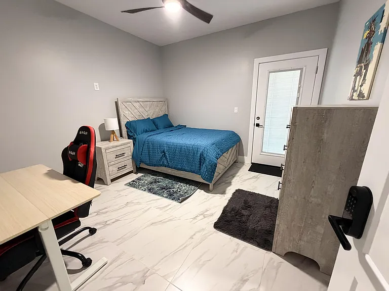 Adjustable blinds built into the exterior door's window, ceiling fan with remote