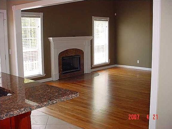 Flowing plan with kitchen open to greatroom with fireplace