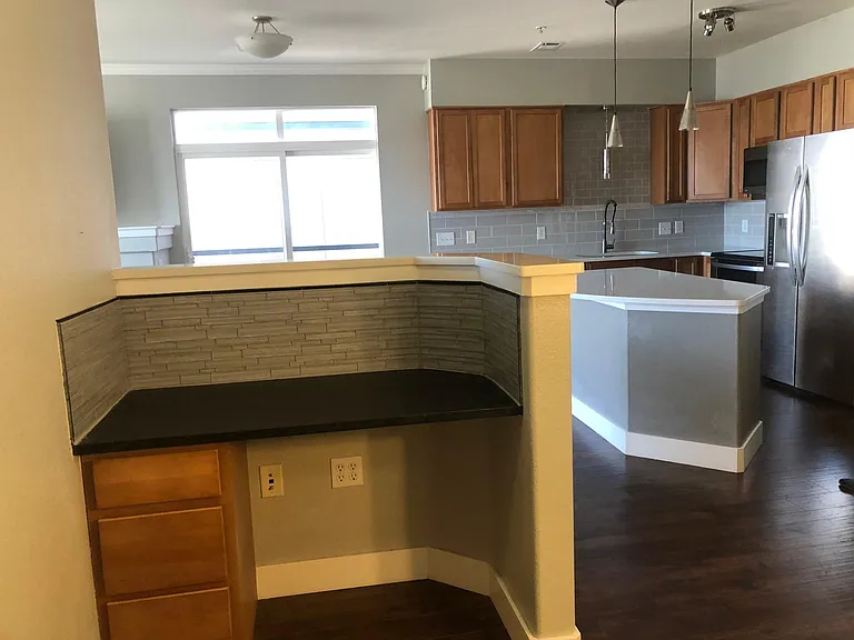 Use this extra space as an in-home bar or workspace! Features new slate countertop and glass backsplash