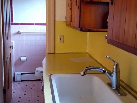 Kitchen leading to bath