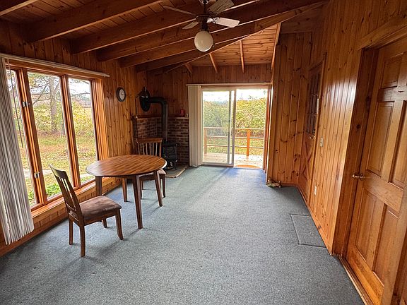 Three season room with wood-burning stove.