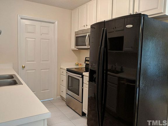 Full kitchen with lots of storage, leading into the laundry room with washer and dryer included.