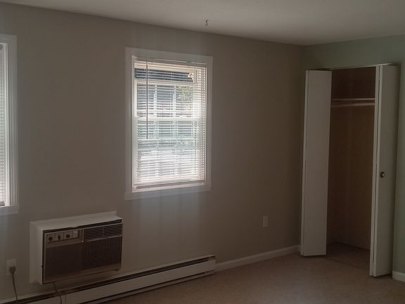 Spacious master bedroom with ample closet space. The master bedroom includes a sleeved air conditioner.