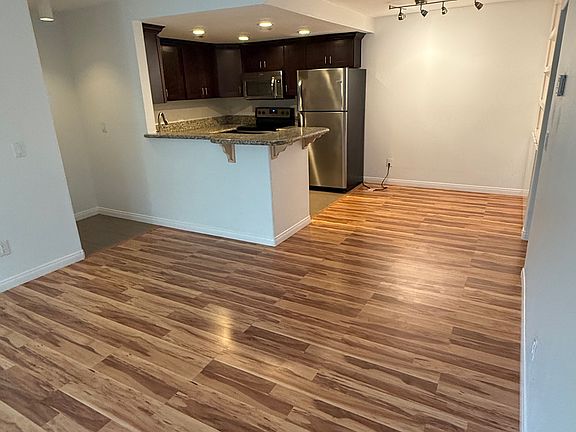 Living room looking towards kitchen and dining area