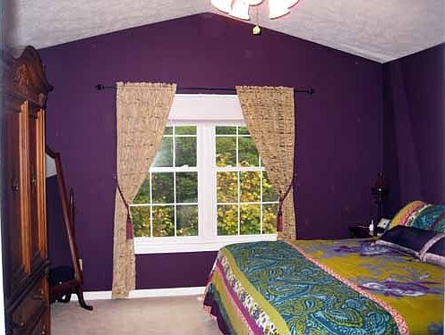 Master bedroom w/ vaulted ceiling w/ fan