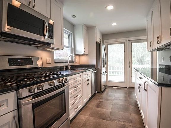 Stunning kitchen with lots of counter space, stainless appliances, granite counter tops, soft close drawers, and pull outs!  Thi