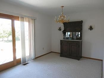 Dining room area with chandelier & door to outside deck