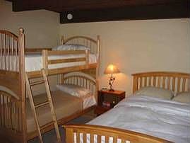 Guest Bedroom.  Queen and bunk beds. Also has washer/dryer in bedroom.