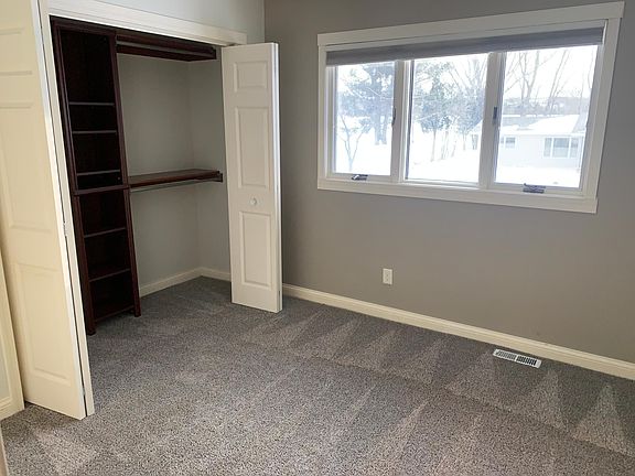 1 of 3 large upstairs bedrooms. Wood built in custom closets.