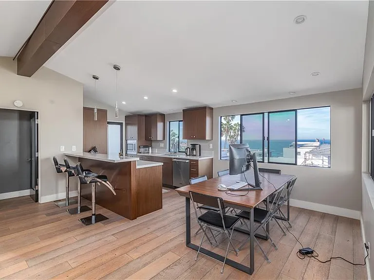 The kitchen opens up to the living room & dining area