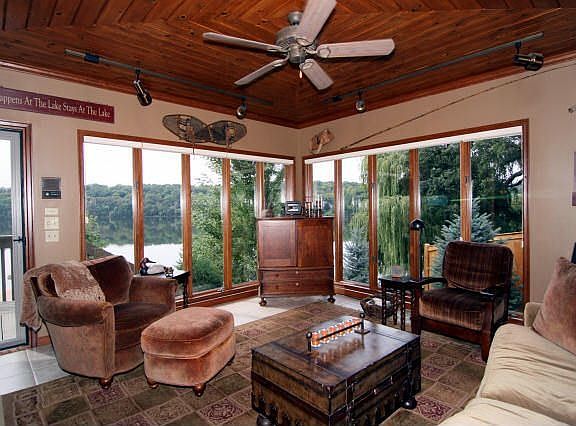 Four season sunroom opens to deck, french doors to kitchen,