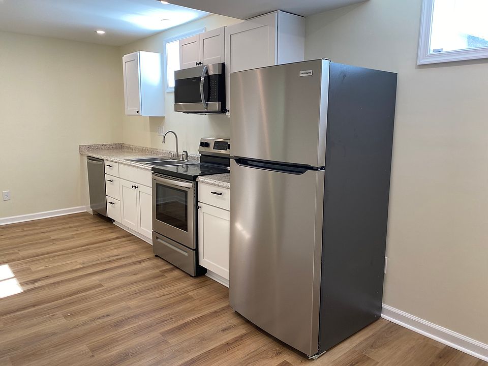 Brand new, soft close, kitchen cabinets with stainless steel appliances.