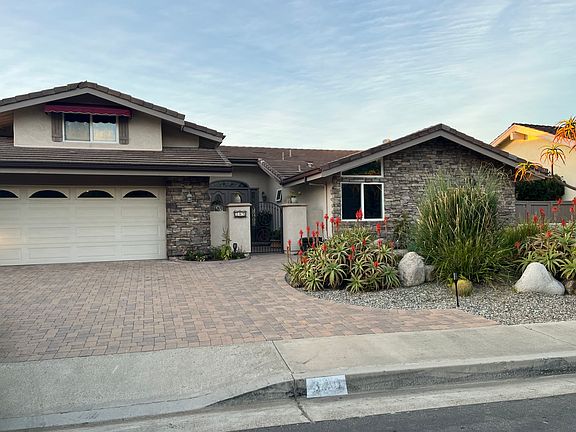 Front of house, two car garage.