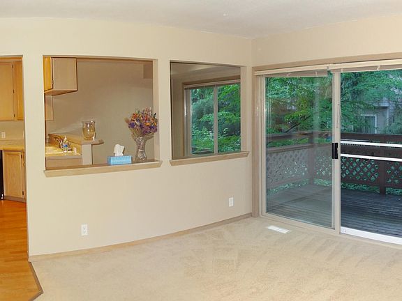 Living room has a large sliding door to a private balcony.