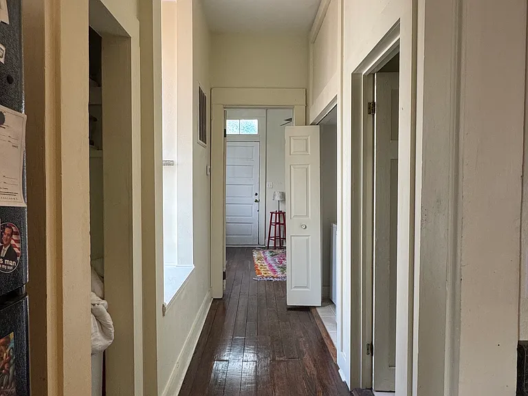 hallway leading to bathroom, w/d, and bedroom