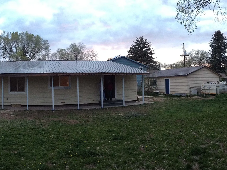 Large fenced-in yard - detached three-car garage on the alley.