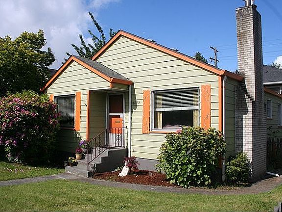 Cute house, green with pumpkin orange trim