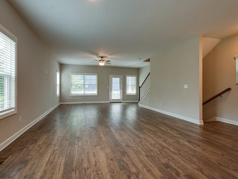 Open concept living area with plenty of space for your living and dining furniture.